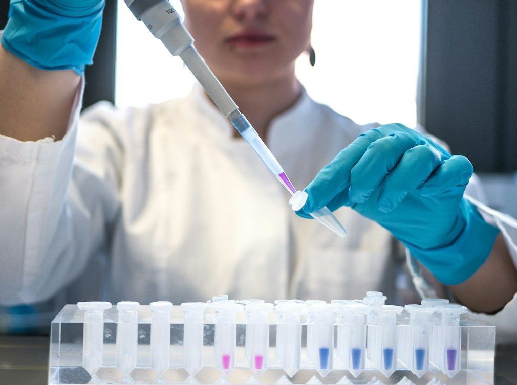 Scientist pipetting a sample during laboratory analysis