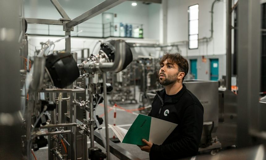 Technician verifying industrial process equipment