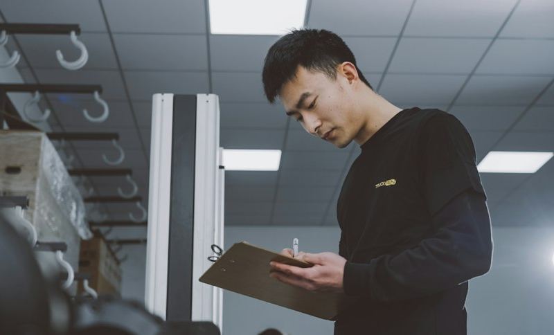 Auditor with a clipboard inspecting a facility