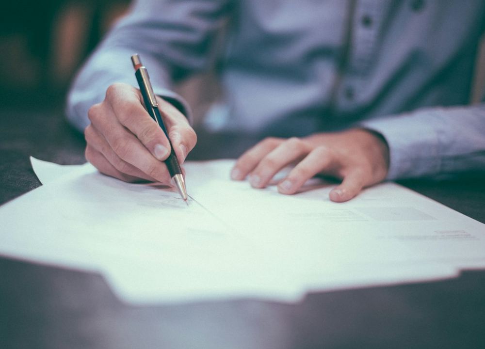 Regulatory documentation being reviewed at a desk
